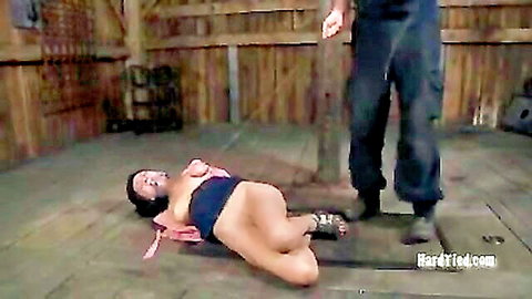 Nyssa Nevers bound and topless in intense BDSM domination