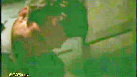 Prison inmate's huge tits exposed as guard fucks her doggystyle against cell bars
