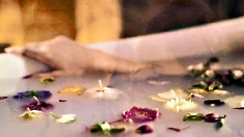 Hailee Steinfeld in steamy flower petal bath scene