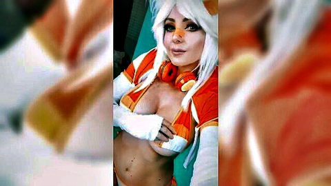 Jessica Nigri in sexy orange cosplay with deep cleavage and fox ears