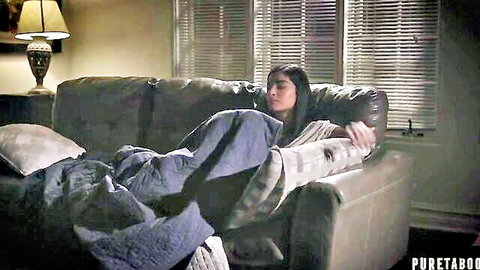 Asian beauty with leg cast sleeping under blanket in taboo trailer