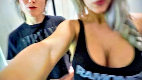 Blonde and brunette busty women in tight tops, cleavage tease after waxing