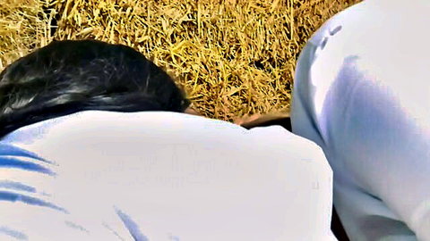 Pamel Black and Mel Black ebony busty models from behind in white outfits in hay field