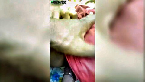 Blurry caught video thumbnail of man gripping Indian woman's thigh during sex