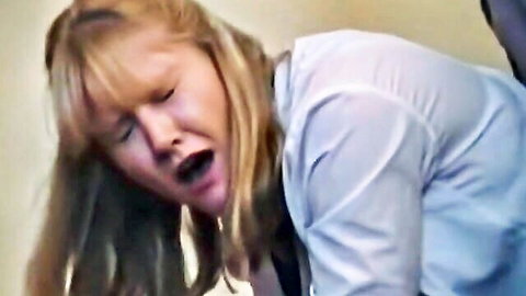 Blonde mature woman screams in pain with mouth wide open during BDSM whipping session