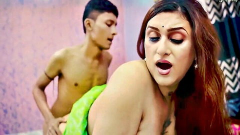 Indian MILF with big natural tits and tattoo moans ecstatically as muscular guy grabs her from behind in doggy fuck