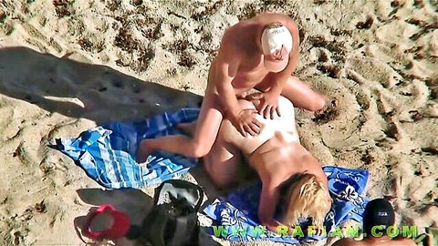 Mature blonde MILF fucked outdoors on beach by older man in missionary