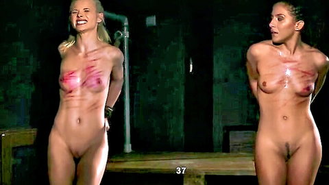 Blonde and brunette bound naked in BDSM with whip marks on big tits