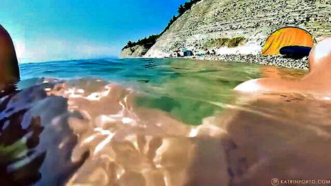 Katrin Porto milf skinny dipping in clear beach waters, outdoor tease