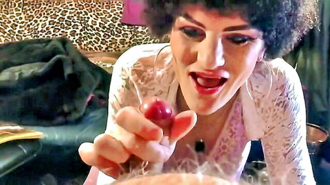 Mature trans woman over 50 teasing with cherry in white lace lingerie