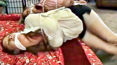 Chloe bound and gagged in white blouse and black skirt BDSM scene