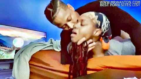 Ebony ex-lovers sharing intimate neck kiss in complicated relationship