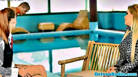 Glamorous redhead and blonde in CFNM chat with shirtless hunk by pool