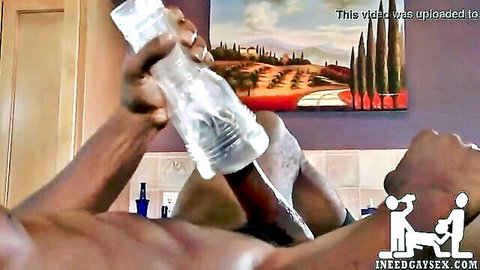 Black African man using clear fleshlight for solo jerk off session