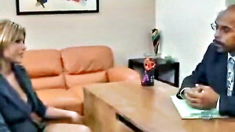 Leigh Livingston blonde in low-cut dress during office interview