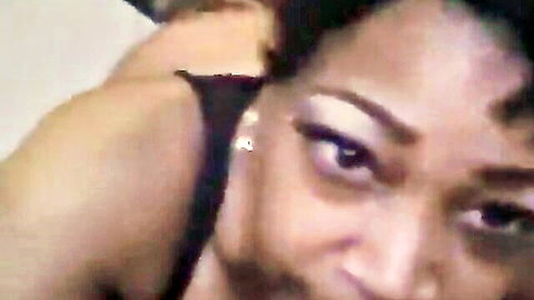Seductive ebony MILF closeup with sultry eyes and glossy lips teasing for sex