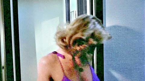 Seductive blonde in purple top looking back in 1978 Erotic Adventures of Candy thumbnail