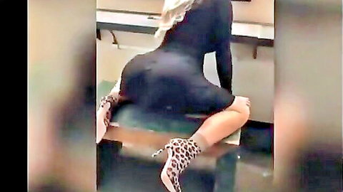 Curvy woman with large butt in tight black dress, bent over showing ass