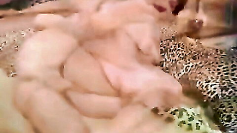 Blurry pale tits and nude bodies intertwined on leopard print bed in bisexual MILF scene