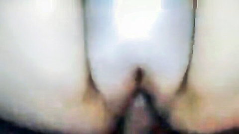 Blurry closeup of pale ass cheeks spread wide exposing dark tight pussy and asshole