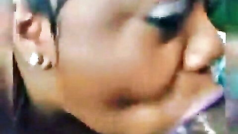 Close-up of black woman with glossy lips in sloppy oral action