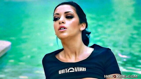 Melina Mason seductive in black top by pool, teasing expression