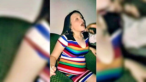 Brunette wife eagerly sucking big black cock in colorful striped dress
