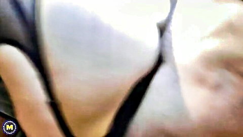Blonde mature MILF exposes massive pale tits pulled from black top