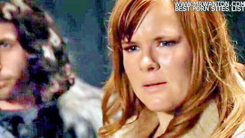 Redhead woman and long-haired man in tense close-up from Game of Bones parody