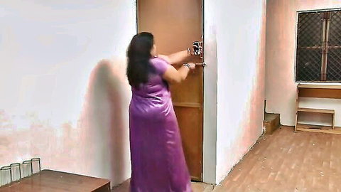Indian mature BBW in shiny purple dress unlocking door, softcore tease