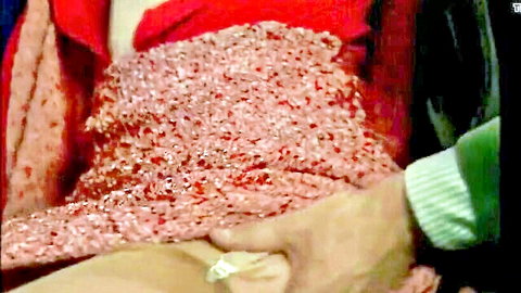 Sylvia Kristel in sparkly red dress with hand on thigh tease