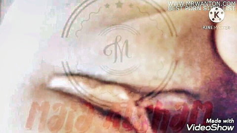 Close-up of tight wet pink pussy lips and labia exposed