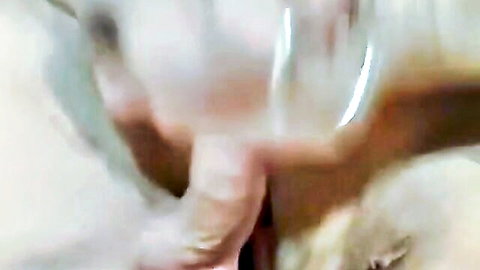 Blurry closeup of pale ass double penetrated by two thick toys in amateur anal play.