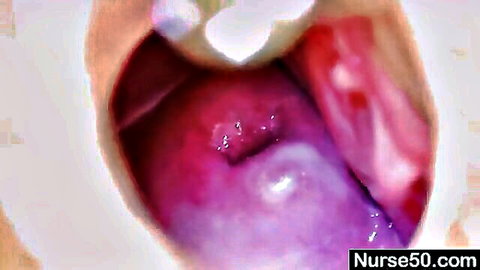 Closeup of gaping wet pink pussy spread wide open by speculum in nurse medical exam