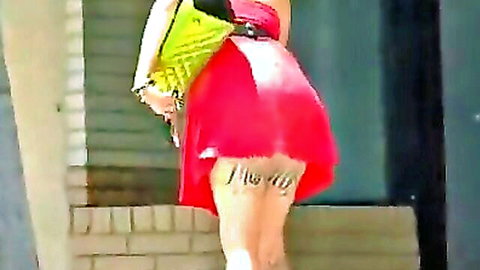 Tattooed babe in red mini dress flashing ass outdoors shopping