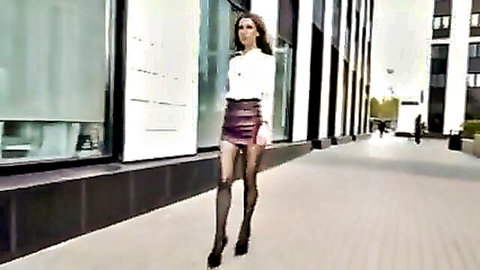 Brunette in tight leather miniskirt sheer stockings struts outdoors teasing upskirt