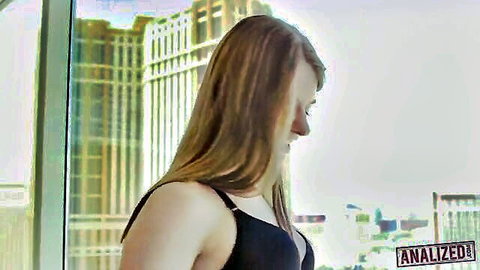 Alice March in black bra, side profile with long blonde hair