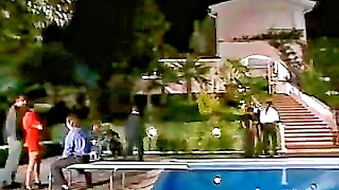 French innocent girl in red dress teased at nighttime poolside with suited men