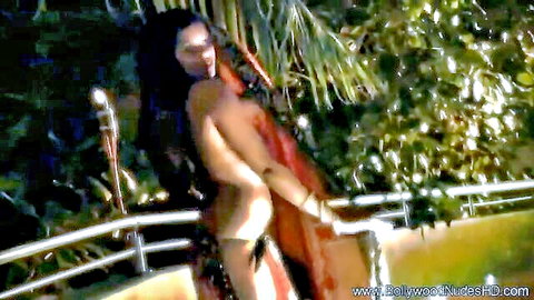 Topless Indian woman in red saree on balcony, Bollywood ex-girlfriend nude scene