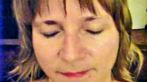 Close-up of ecstatic blonde German woman with eyes closed