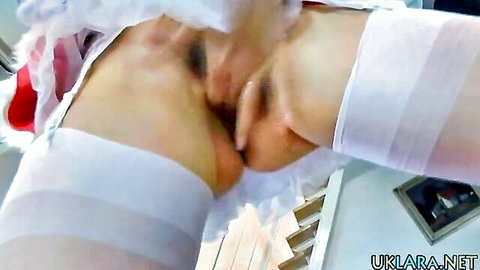 Mature MILF in white stockings spreads legs as hand fingers her wet pussy closeup