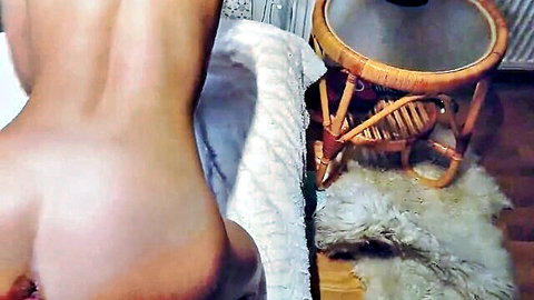 Fit amateur babe's perfect round nude ass from behind in homemade bedroom.