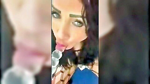 Exotic brunette teasing with ice cubes in blue lingerie, sultry close-up