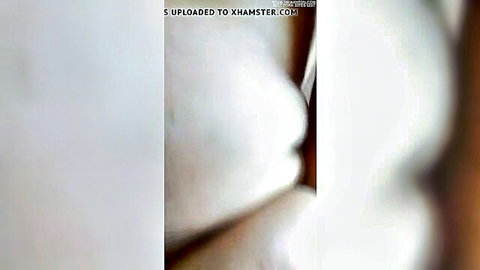 Blurry closeup of white bedsheet or skin in softcore tease