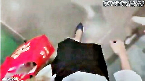 POV of sexy Southeast Asian woman in tight black skirt and high heels walking with red bag upskirt tease