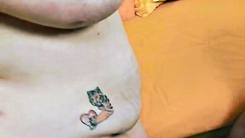 Pale BBW mature woman's soft belly closeup with tiger tattoo near pubic mound