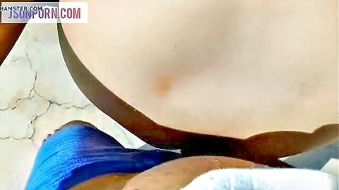 Dark brown cock pressing against pale woman's exposed big ass for anal sex