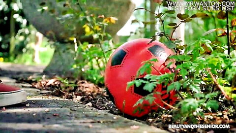 Outdoor garden scene with red soccer ball, stalking old bald guy vibe, Beauty And The Senior