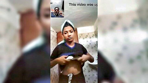 Indian woman lifts jersey exposing underboob and toned abs in bathroom tease