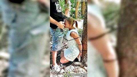 Belgian MILF tied to tree in woods, kneeling deepthroat oral on man